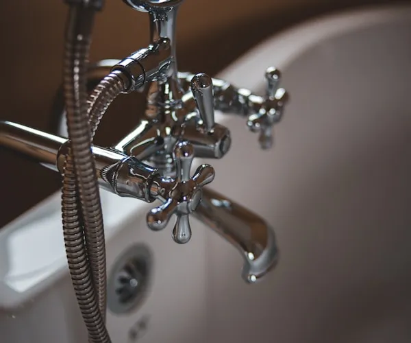 Gas engineer servicing a boiler in a London home
